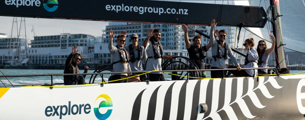 friendly Explore crew and passengers on an America's Cup Sailing yacht