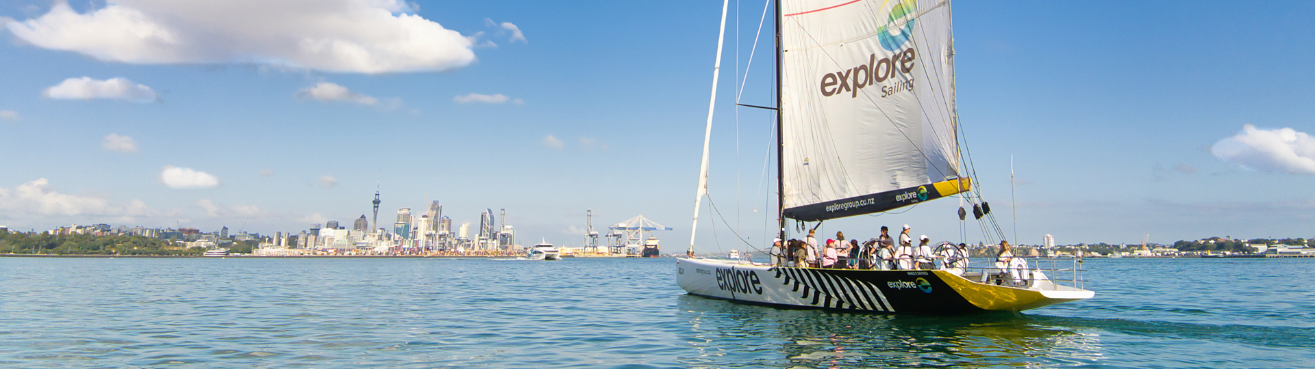 Explore Group | Auckland | Sailing with city in background