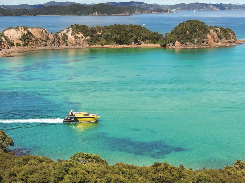 Explore boat travelling through the Bay of Islands